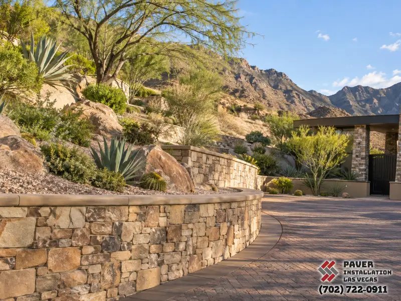 Concrete Block Retaining Wall Installation in Las Vegas, NV: Stone-faced retaining wall alongside a garden path
